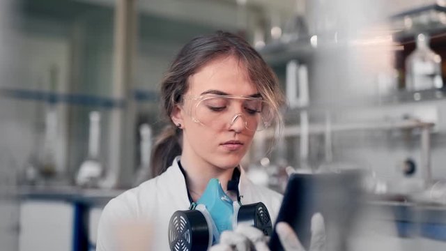 female scientist with tablet in lab