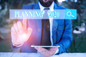 Word writing text Planning 2020. Business photo showcasing process of making plans for something...