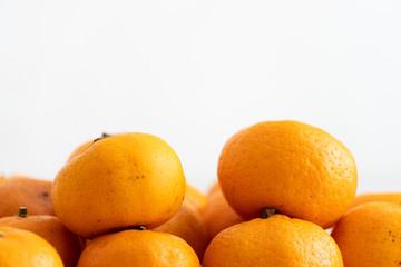 multiple orange on  white marble surface. Concept for fruit nutrition and diet food.