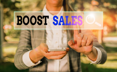 Handwriting text Boost Sales. Conceptual photo move sales profit from a lower to a higher place or...