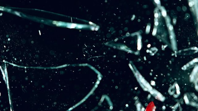 Super Slow Motion Shot of Crowbar Glass Break at 1000 fps Isolated on Black Background.