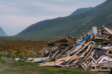 Fototapeta na wymiar Big heap of garbage near the sea on Lofoten Islands, Norway