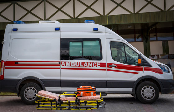 Paramedics emergency rescue team's stretcher and ambulance car is ready to help.