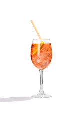 Aperol Spritz cocktail with a slice of orange, ice cubes and an orange straw is contained in a high...