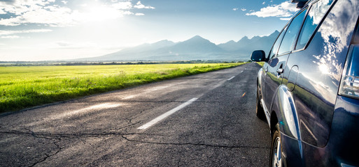 car for traveling with a mountain road © nickolya