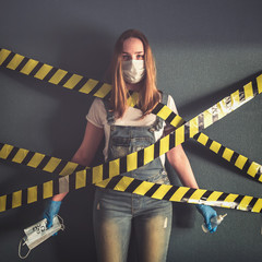 Coronavirus. Quarantines, house isolation. Girl with masks and sanitizer in hands. Safety, hygiene and quarantine at home. World pandemic of the virus corona.