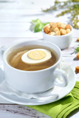 chicken broth with egg and crackers