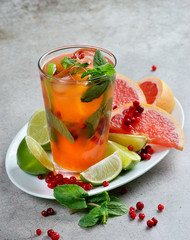 cocktail with berries, orange and mint
