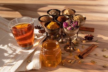 Assortment of different spices in small metal glasses