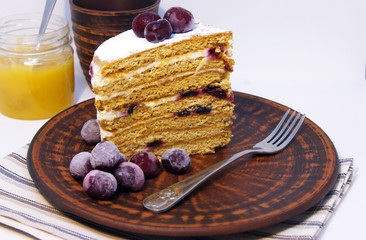 Slice of homemade honey cake , light background