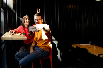 Two young people in Fast Food Restaurant	