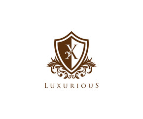 Fototapeta premium Vintage Letter X Logo. Shield X Letter Design Vector with shield shaper and Floral Hand Drawn.