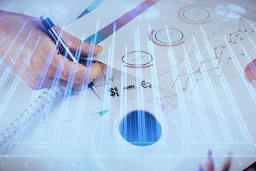 Multi exposure of man planing investment with stock market forex chart.