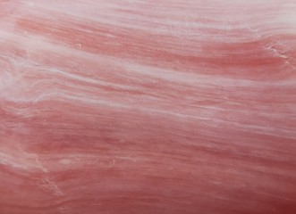 Beautiful soft pink texture with white streaks, similar to the texture of stone, marble, soap. Close up