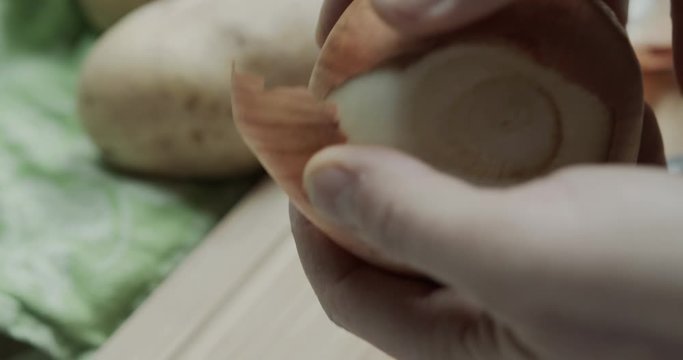 Cutting an onion on a chopping board