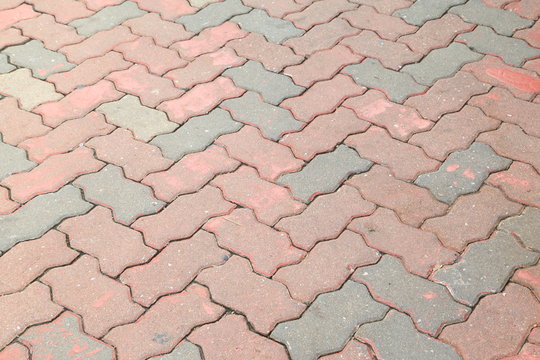 Red and gray bricks pavement texture.