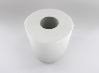 Overhead view of vertical white toilet paper roll, isolated on white background. Maximum hygiene with this soft, resistant and long household toilet paper.