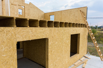Construction of new and modern modular house. Walls made from composite wooden sip panels with...
