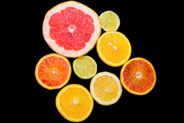 Fresh citrus fruit on black background