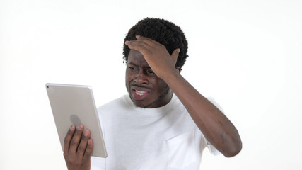 Casual African Man Reacting to Loss on Tablet Isolated on White Background