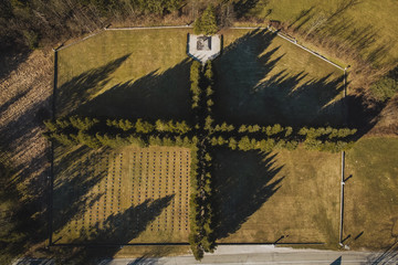 Aerial view of a military cemetery in the valley of Soca. Visible tombstones on one fourth of a graveyard, looking from above. © Anze