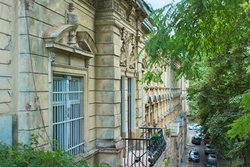 Facade of an old historic house with molding, view of the third floor