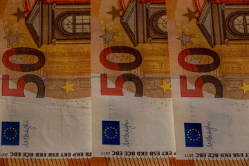 Three fifty euro note next to each other, close up