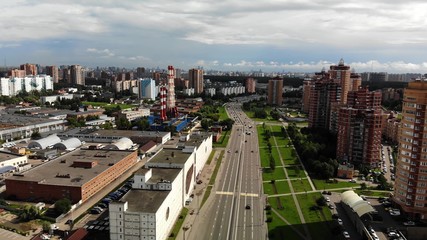 Aerial view of road and buildings near. Big town footage fly drone.