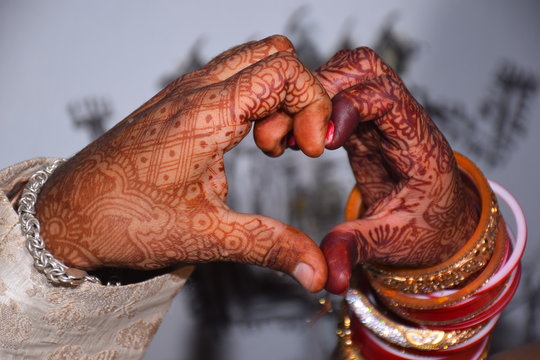 Heart shaped, Indian matrimonial tradition made by the hands of a newly married couple.