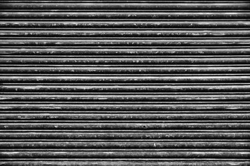 Old Roll-up Garage Gate. Old rusty garage doors.