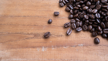 dark rose coffee bean, Black coffee cup on old wooden table top view.