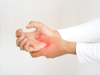 rheumatoid arthritis and repetitive motion injuries,including carpal tunnel syndrome in woman and she touching on her hand and symptoms of pain and swelling use for health care concept.