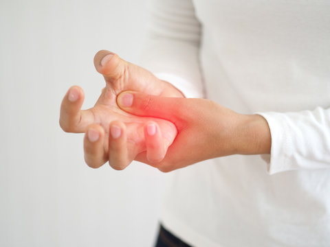 rheumatoid arthritis and repetitive motion injuries,including carpal tunnel syndrome in woman and she touching on her hand with red and symptoms of pain and swelling use for health care concept.