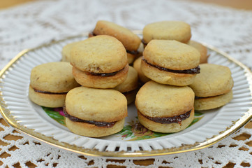 Traditional serbian vanilla cookies with jam, vanilice, on the vintage plate, close up