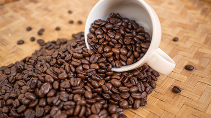 dark rose coffee bean, Black coffee cup on old wooden table top view.
