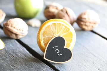 Healthy eating concept, vintage style. Lemon and nuts on the table.