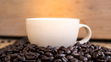 dark rose coffee bean, Black coffee cup on old wooden table top view.