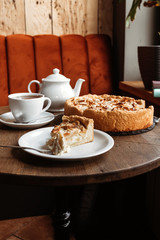 Table in a cafe, tea with apple pie.