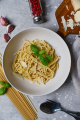 Restaurant food delivery lunch at home. spaghetti with Parmesan cheese and herbs. food delivery to quarantine COVID-19. recipe homemade pasta. classic Italian cuisine. selective focus