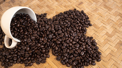 dark rose coffee bean, Black coffee cup on old wooden table top view.