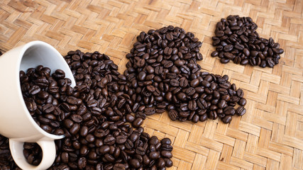 dark rose coffee bean, Black coffee cup on old wooden table top view.