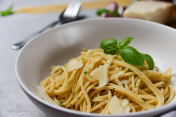 Restaurant food delivery lunch at home. spaghetti with Parmesan cheese and herbs. food delivery to quarantine COVID-19. recipe homemade pasta. classic Italian cuisine. selective focus