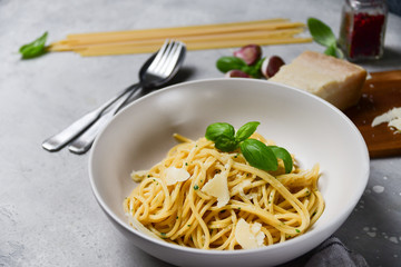 Restaurant food delivery lunch at home. spaghetti with Parmesan cheese and herbs. food delivery to quarantine COVID-19. recipe homemade pasta. classic Italian cuisine. selective focus