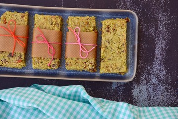 Matcha green tea breakfast bars made from oat, matcha powder, maple syrup, goji berry, pumpkin seed, sunflower seed, date, brazil nuts and sesame seeds. 