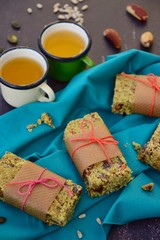 Matcha green tea breakfast bars made from oat, matcha powder, maple syrup, goji berry, pumpkin seed, sunflower seed, date, brazil nuts and sesame seeds. Served with hot tea
