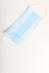 Medical mask for protection against flu and corona virus on white background
