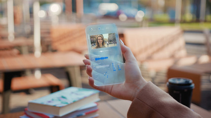 Income Call on his Transparent Phone. Future Smartphone. The Woman Use Smartphone with Futuristic Design. Concept of Digital Future. Technology of Holographic. Digital Technology. Business Background.