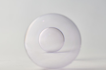 eyeglass lens on white background, photo concept for medical or education use about vision disorders