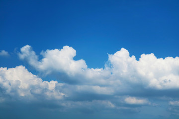 pure white heap cloud and sunlight shining and pass on blue sky