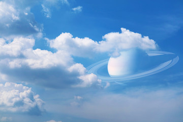 Saturn back on pure white heap cloud and sunlight shining and pass on blue sky © darkfoxelixir